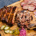 Feast on Our Brisket + Ribs Meal – Perfect for 6-8